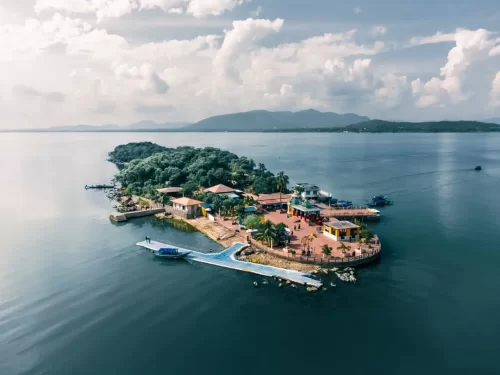 Chilika Lake Kalijai Island Odisha aerial view Maa Kalijai Temple jetty boats distant mountains serene waters, perfect Puri birdwatching boat safari tour package.