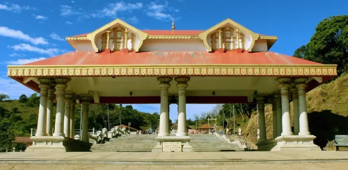 Talakaveri Temple in Kodagu during daylight, featuring hilltop temple and scenic Western Ghats, perfect spiritual experience, Karnataka tour packages.