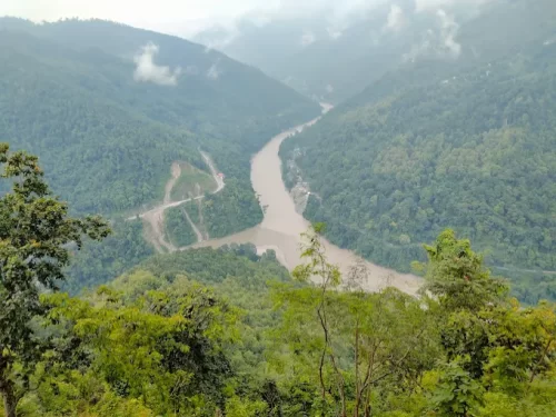 7th Mile View Point in Kalimpong, West Bengal, overlooking the Teesta River winding through lush green hills, a popular scenic halt featured in West Bengal tour packages.