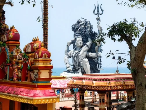 Aazhimala Shiva Temple, Kerala India giant Lord Shiva statue, seaside Hindu pilgrimage site by Arabian Sea.