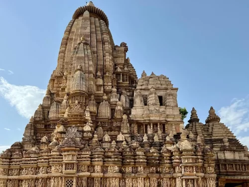 Adinath Jain Temple in Khajuraho, Madhya Pradesh, showcasing intricate sandstone carvings and towering shikhara architecture, a highlight of Madhya Pradesh tour packages