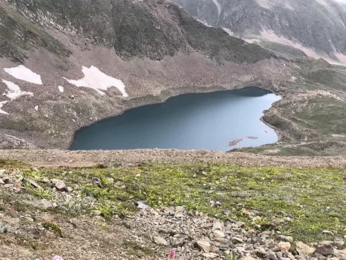 Alpather Lake Gulmarg high-altitude alpine lake surrounded by Himalayan mountains and rocky terrain in Kashmir