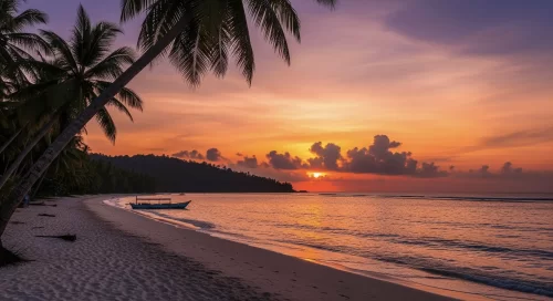 Radhanagar Beach at Havelock Island during sunset, featuring palm trees and turquoise waters, romantic Andaman tour package.