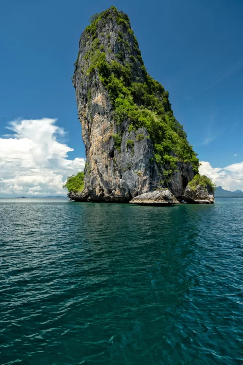 Towering limestone island rising from emerald waters in Andaman showcasing pristine seascape and dramatic coastal beauty perfect for Andaman island tour packages