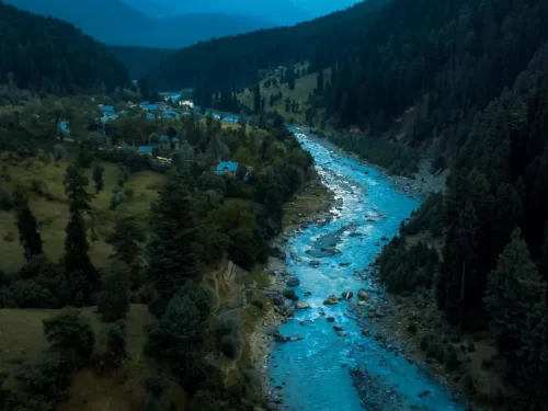 Aru Valley Pahalgam Kashmir night aerial turquoise Lidder River pine forests mountains, village lights blue dusk shadows meadows, perfect Jammu Kashmir Kolahoi base valley package.