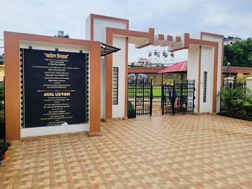 Atal Udyan Adabari Park Guwahati entrance during cloudy day, featuring welcome gate landscaping, perfect family picnic experience Assam tour package.