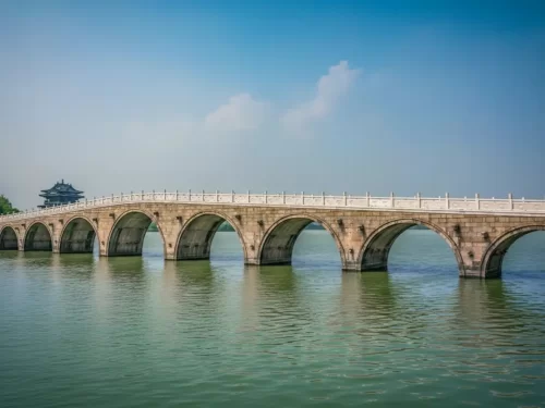 Atharnala Bridge, historic 13th century stone bridge in Puri, Odisha featuring eighteen graceful arches over the river.
