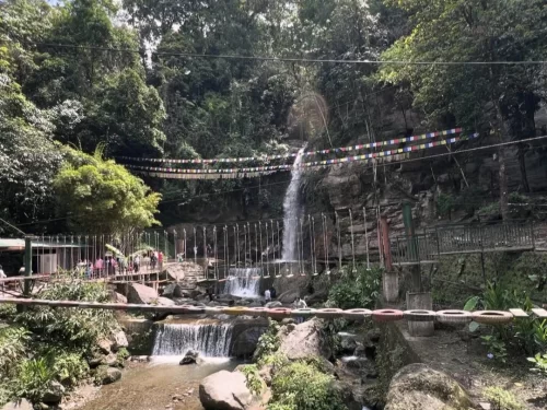 Ban Jhakri Falls Park Gangtok Sikkim scenic waterfall with suspension bridge and lush forest surroundings