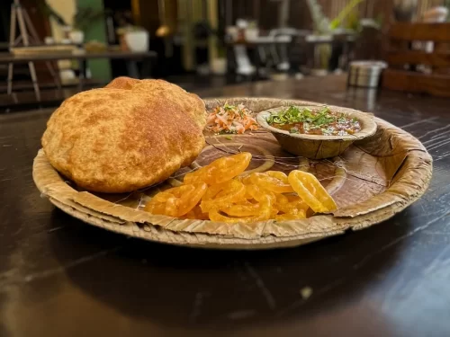 Taj Mahal at Agra during sunset, featuring water reflections, perfect romantic experience Uttar Pradesh tour package.