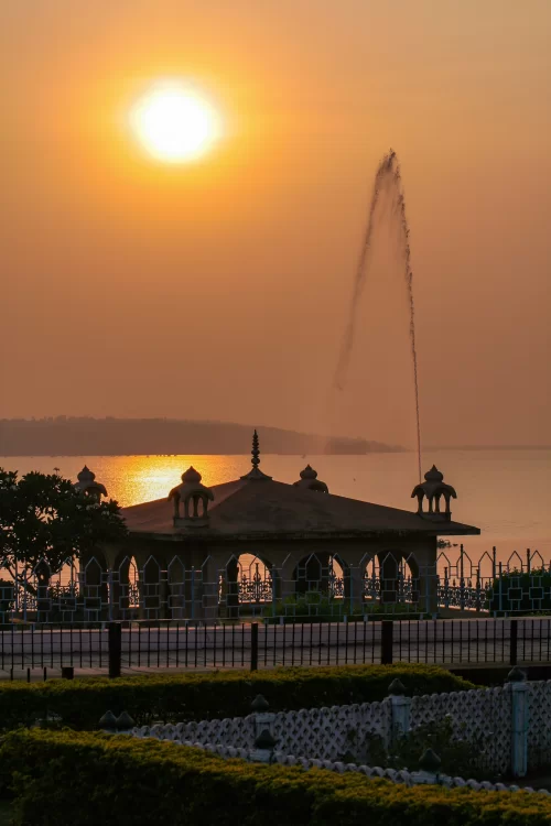 Sunset view at Upper Lake Bhopal with pavilion silhouette and golden reflections on the water highlighting serene lakeside charm perfect for Bhopal sightseeing tours and Madhya Pradesh travel packages