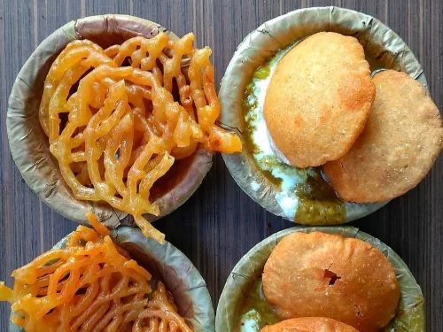 Taj Mahal at Agra during sunset, featuring water reflections, perfect romantic experience Uttar Pradesh tour package.