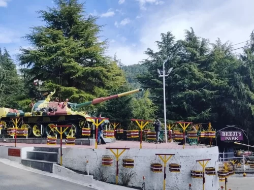 Beeji’s Park Manali with Indian Army tank display surrounded by cedar trees in Himachal Pradesh