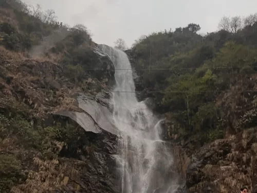 Bheem Nala Fall Sikkim tall cascading waterfall near Lachung in Himalayan mountain landscape