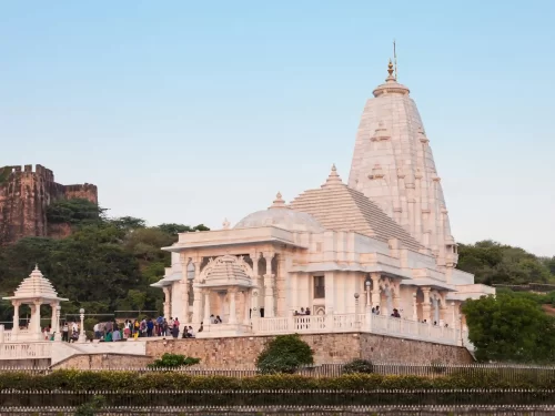 Birla Mandir white marble temple with intricate shikharas and carvings, a famous religious landmark in Jaipur, Rajasthan.