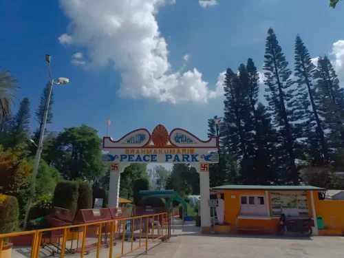Brahma Kumaris Peace Park lush green gardens and colorful flower beds at the spiritual retreat in Mount Abu, Rajasthan.