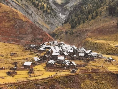 Chakwali Village Gurez Valley traditional wooden houses surrounded by alpine mountains and scenic landscapes in Kashmir