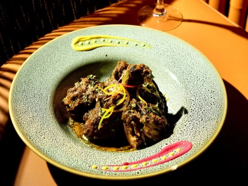 Sunset at Goa beach during evening, featuring palm trees and boats, perfect romantic experience Goa tour package.