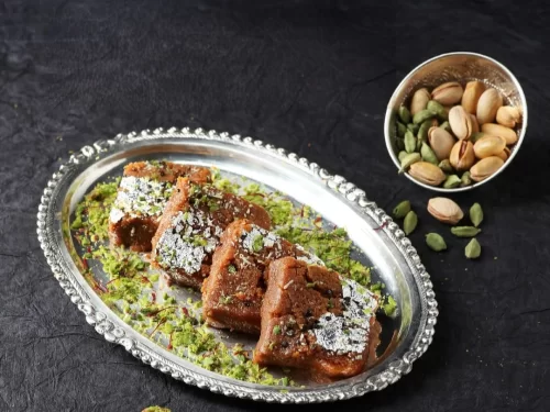 Camel safari at Jaisalmer during sunset, featuring sand dunes, perfect adventure Rajasthan tour package.