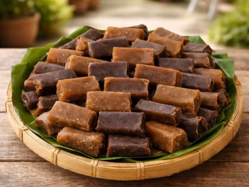 Sunset at Goa beach during evening, featuring palm trees and boats, perfect romantic experience Goa tour package.