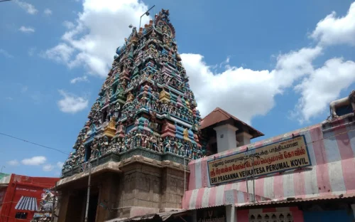 Shri Murugan Temple during daylight, featuring colorful gopuram and intricate carvings, perfect spiritual experience, Tamil Nadu tour packages.