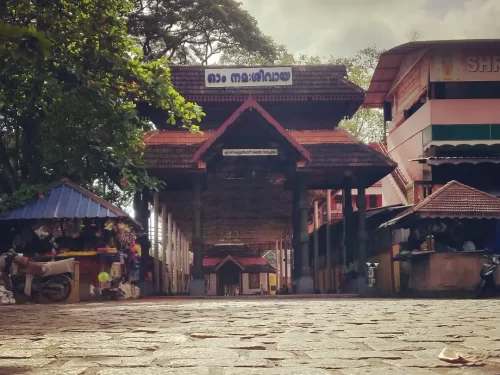 Ernakulam Shiva Temple, Kerala traditional temple entrance with tiled roof and stone pathway