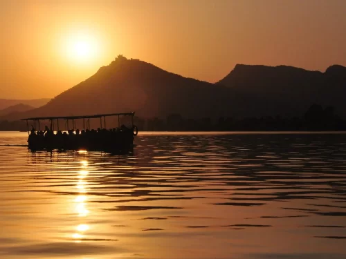 Fateh Sagar Lake scenic waterfront with the Nehru Garden island and distant Aravali hills at the popular Udaipur landmark.