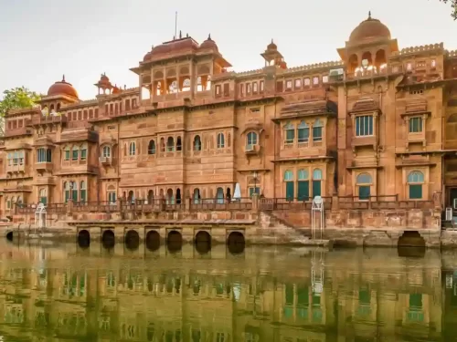 Gajner Lake scenic artificial lake surrounded by a sanctuary and the red sandstone Gajner Palace in Bikaner Rajasthan.