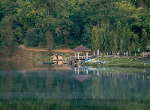 Ganga Lake serene freshwater lake surrounded by dense forest with calm reflections and boating view in Arunachal Pradesh Package.