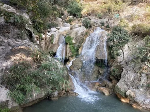 Garud Chatti Waterfall Rishikesh scenic natural cascade with rocky pools and lush greenery near Neelkanth Road