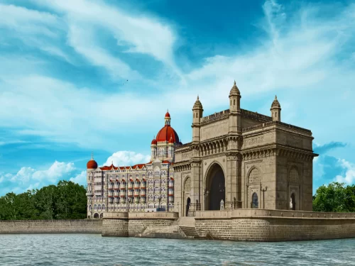 Gateway of India and Taj Mahal Palace Hotel waterfront view in Mumbai, showcasing iconic heritage architecture along the Arabian Sea and prime location for luxury stays and city sightseeing.