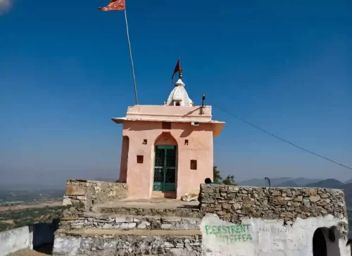 Gayatri Mata Temple panoramic hilltop view of the white shrine overlooking the holy Pushkar Lake and town in Rajasthan.