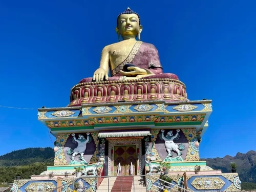 Giant Buddha Statue majestic golden seated Buddha monument against clear blue sky in Arunachal Pradesh Package.