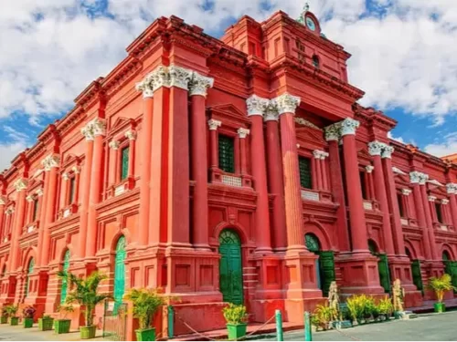 Government Museum and Venkatappa Art Gallery. Historic red colonial building showcasing Karnataka art and archaeological collections in Bengaluru.