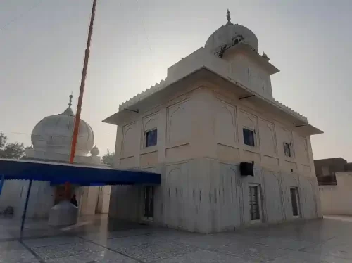 Gurudwara Sri Guru Singh Sabha magnificent white marble Sikh temple featuring a central dome and traditional architecture in the heart of Udaipur Rajasthan.