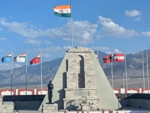 Hall of Fame Leh Ladakh Indian Army war memorial stone pyramid cenotaph multiple nation flags India Pakistan Turkey soldier statue snowy mountains blue sky military history museum Kargil heroes