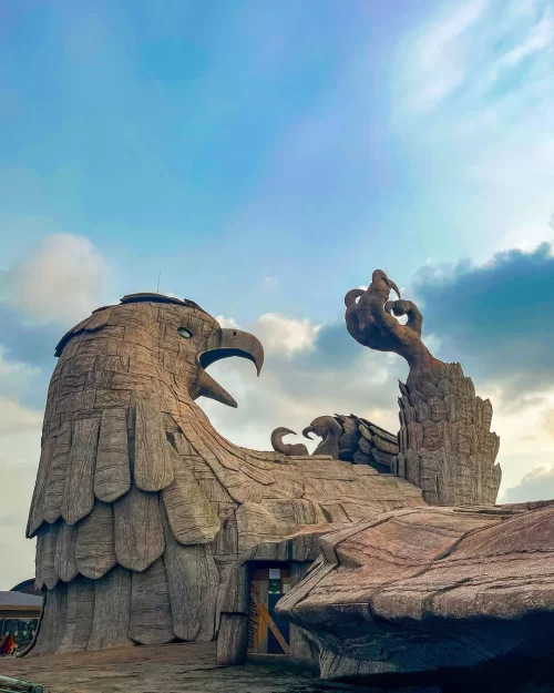 Grand Jatayu statue at Jatayu Earth’s Center near Kovalam, Kerala, showcasing the massive eagle sculpture under a vibrant sky, a must-visit attraction featured in Kerala tour packages.