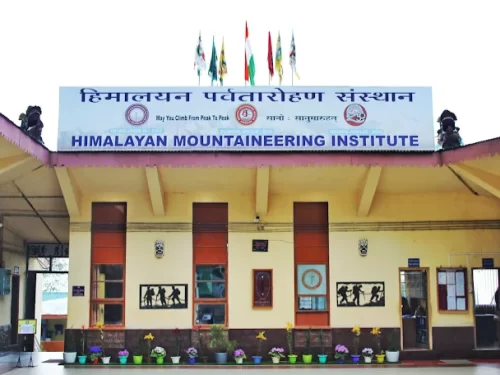 Himalayan Mountaineering Institute in Darjeeling, West Bengal, featuring its iconic entrance building with mountaineering displays and national flags, a renowned adventure training center included in West Bengal tour packages.