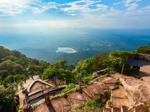 Honeymoon Point scenic overlook in Mount Abu featuring the famous Love Rock and panoramic views of the green Nakki Lake valley in Rajasthan.