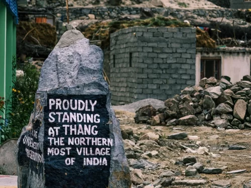 Turtuk village Ladakh Nubra Valley black stone sign Proudly standing at Thang the most northern village of India stone houses rocky hills green door, perfect border cultural tour package.