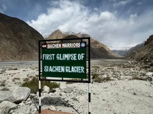 Siachen Warriors monument first glimpse Siachen Glacier signboard Nubra Valley Ladakh rugged Karakoram mountains Indus river valley military base camp viewpoint Partapur Indian Army tribute tourism spot.