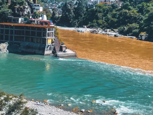 Rudraprayag Rudranath Temple riverside view Alaknanda Mandakini confluence brown turquoise waters temple buildings hills forests, perfect Char Dham Yatra spiritual riverside attraction, Himachal Pradesh tour packages.
