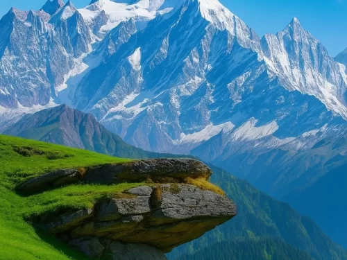 Khaliya Top Munsiyari during clear weather, featuring Panchachuli peaks, overhanging rock, green meadows, perfect trekking adventure, Uttarakhand tour packages.