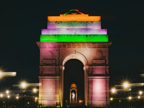 India Gate, New Delhi – iconic war memorial illuminated at night in Indian tricolour lights, popular patriotic landmark and must-visit stop on Delhi city tour packages