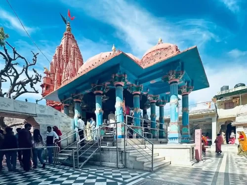 Jagatpita Shri Brahma Temple rare and sacred white marble Hindu shrine featuring a distinctive red spire and bird motifs in the holy town of Pushkar Rajasthan.