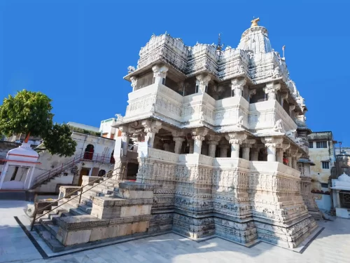 Jagdish Temple grand three-story Indo-Aryan style stone structure featuring ornate pillars and a black marble statue of Lord Vishnu in the heart of Udaipur Rajasthan.