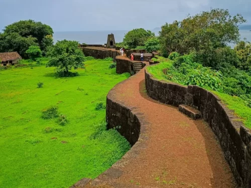 Jaigad Fort in Maharashtra overlooking the Arabian Sea with historic stone ramparts, lush green surroundings and coastal views, a prominent heritage site featured in Maharashtra tour packages