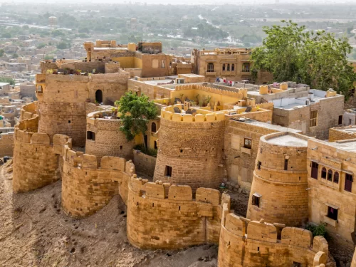 Jaisalmer Fort aerial view golden sandstone bastions towers surrounding havelis desert cityscape featured in Rajasthan tour packages