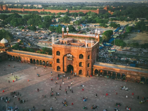 Jama Masjid Delhi aerial view of main gate and courtyard, famous historical mosque and top tourist attraction included in Old Delhi tour packages