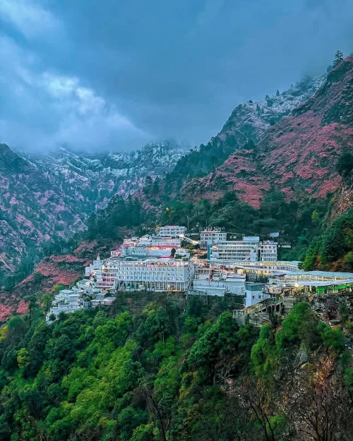 Vaishno Devi Temple nestled in the Trikuta Hills near Srinagar, Jammu and Kashmir, surrounded by lush green valleys and misty mountains, a sacred pilgrimage destination featured in Kashmir tour packages.