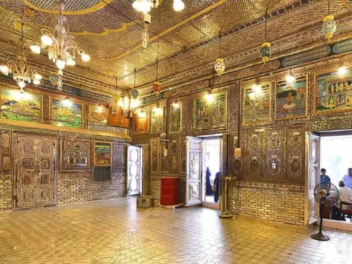 Intricate mirror work and glass-panelled interiors inside Kanch Mandir in Indore, a stunning Jain temple in Madhya Pradesh often featured in Madhya Pradesh tour packages for its unique architecture.